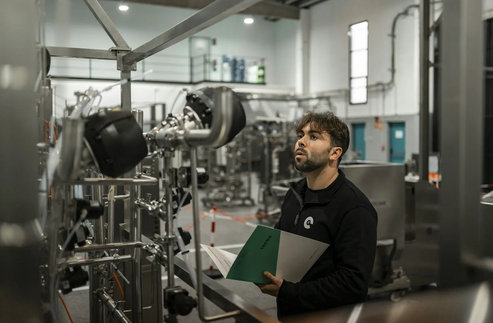 Technician inspecting commercial generator machinery during scheduled maintenance